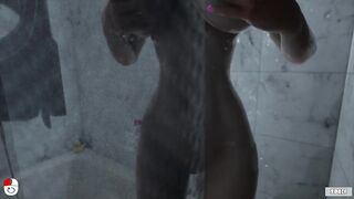 Silicon Lust caresses her tight pussy in the shower and washes her big breasts